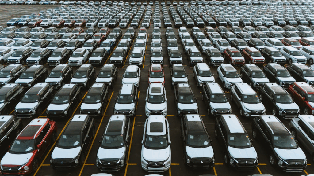 Dealership lot filled with SUvs and the best used pickup trucks under $30K in 2025.
