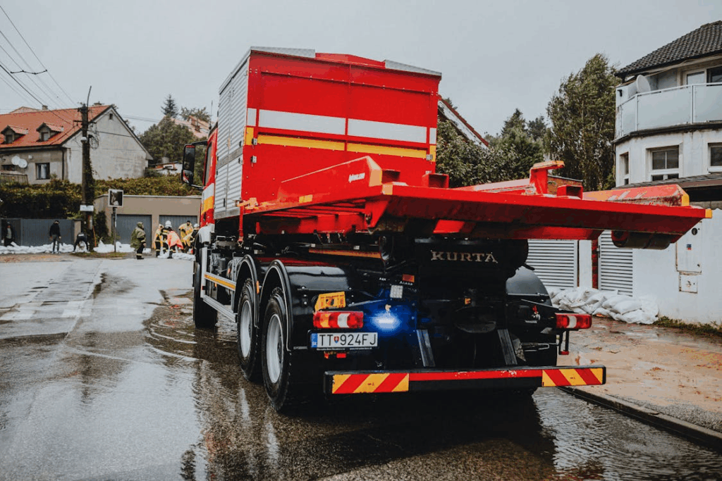 Heavy-duty flatbed truck with tow package for towing large trailers.