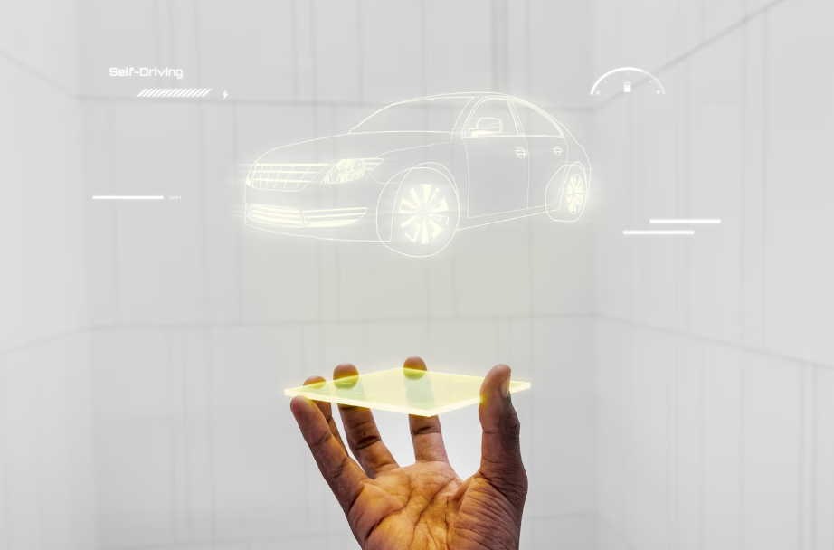 Futuristic hologram of a self-driving car projected from a smart device, representing CES 2025 car technology and connected vehicle systems.